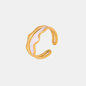 Gold ring with sculpted white enamel wave detail