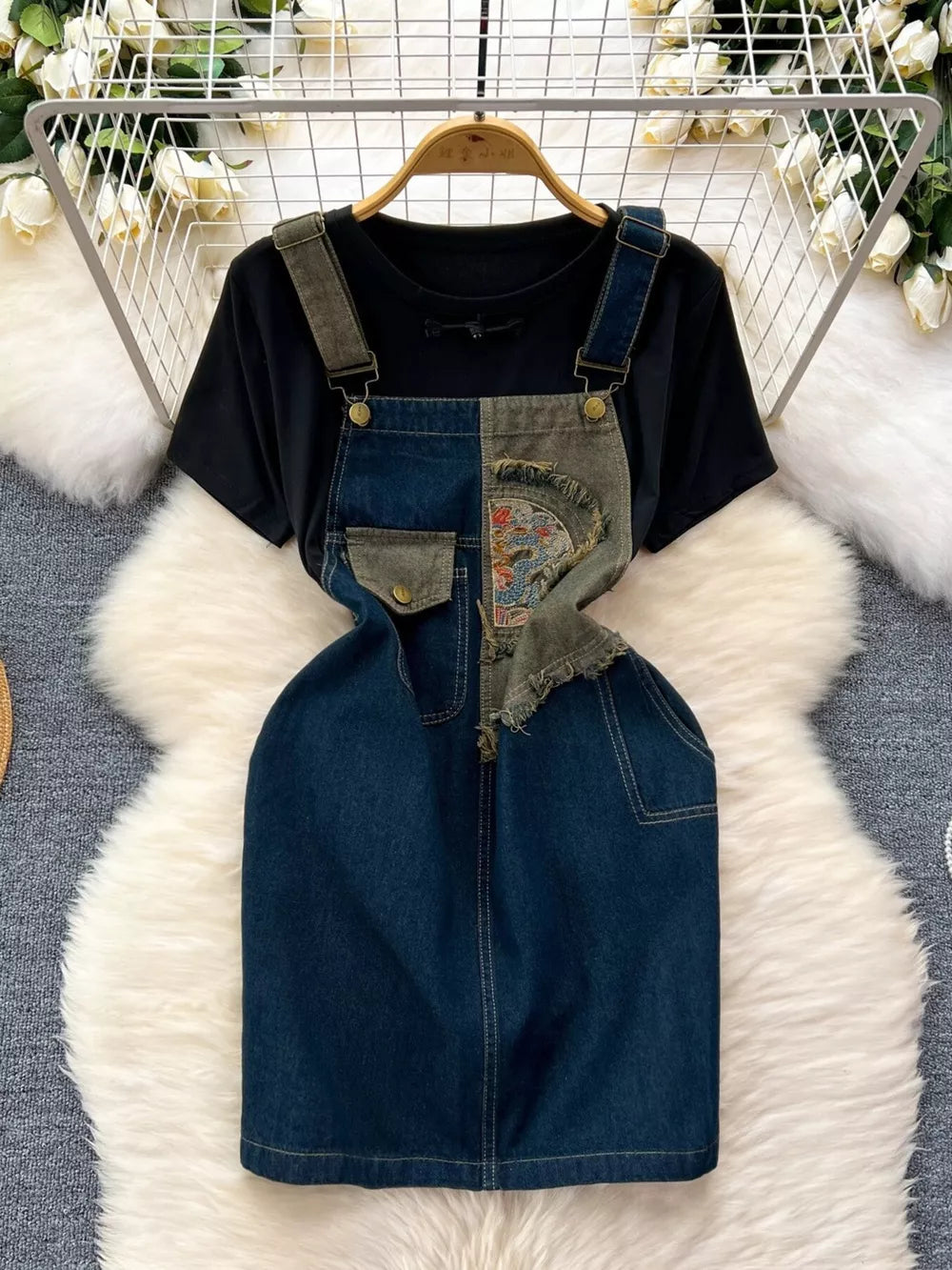 Black cotton tee with distressed denim overall dress featuring patchwork and embroidery.