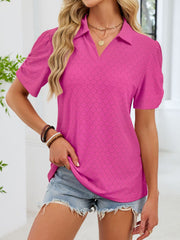 Hot pink eyelet ruched short sleeve blouse with a collared neckline.