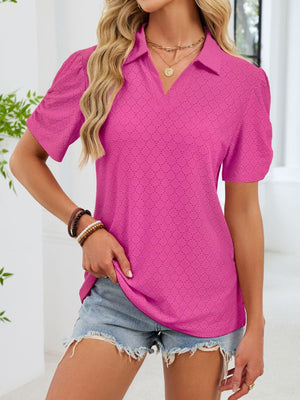 Hot pink eyelet ruched short sleeve blouse with a collared neckline.