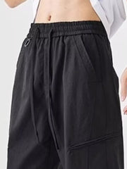 Black wide-leg sweatpants with drawstring waist and pockets.