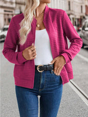Quilted bomber jacket in Deep Rose with zip closure and stand-up collar.