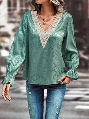 Turquoise satin blouse with lace inset V-neck and ruffle cuffs