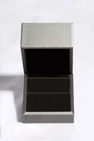 Silver ring box with brushed metal lid and black interior