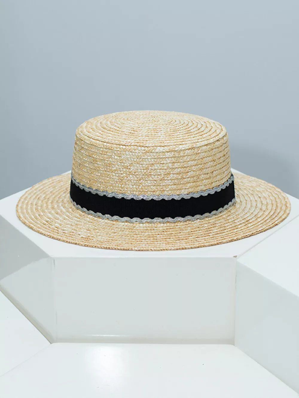 Straw boater hat with black and silver decorative band