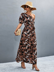 Tropical print one-shoulder maxi dress with balloon sleeves and a tie waist.