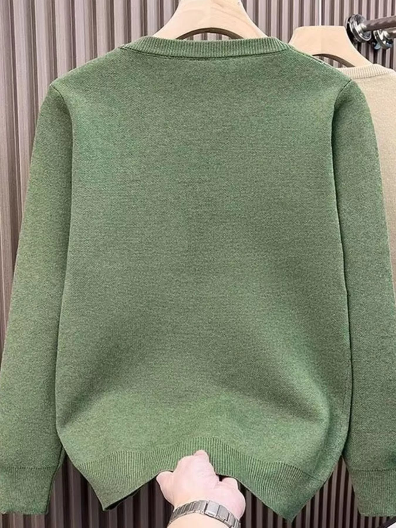 Men's green long sleeve crewneck sweater with ribbed hem and cuffs.