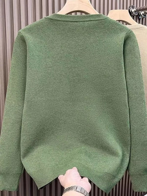 Men's green long sleeve crewneck sweater with ribbed hem and cuffs.