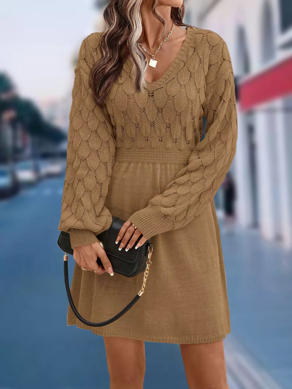 Tan openwork knit v-neck sweater dress with cinched waist and above knee length.