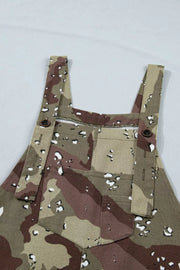 Cropped denim overalls with camouflage pattern and button details.