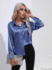 Royal blue satin tie-front blouse with buttoned front and collar.