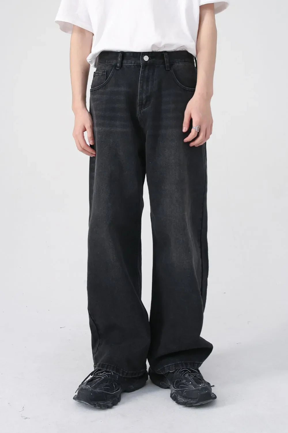 Black wide-leg denim jeans with a relaxed fit and urban style.