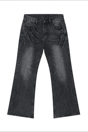 Washed black wide-leg denim jeans with distressed detailing and a bootcut flare.