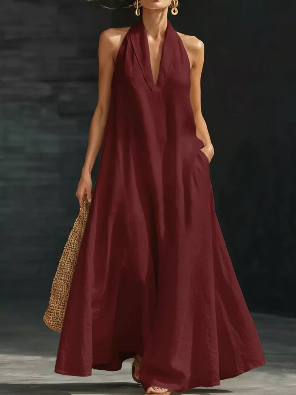 Burgundy halter neck maxi dress with pockets, 100% polyester, V-neck, flowy skirt.