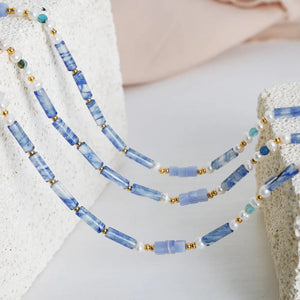 Lapis Lazuli & Pearl Bead Necklace with gold accents and light blue marbled beads.