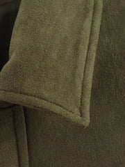 Oversized zip-up jacket in military green suede with visible stitching detail.