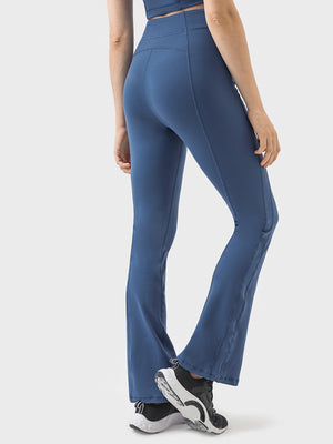 Dark Blue Sculpted Flare Active Zip Trousers with a high waist and subtle stitching detail.