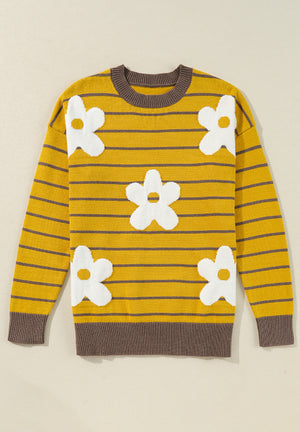 Yellow striped knit sweater with white daisy intarsia and brown trim.
