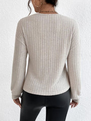 Dust Storm ribbed knit top with blouson sleeves and a cross-front detail.