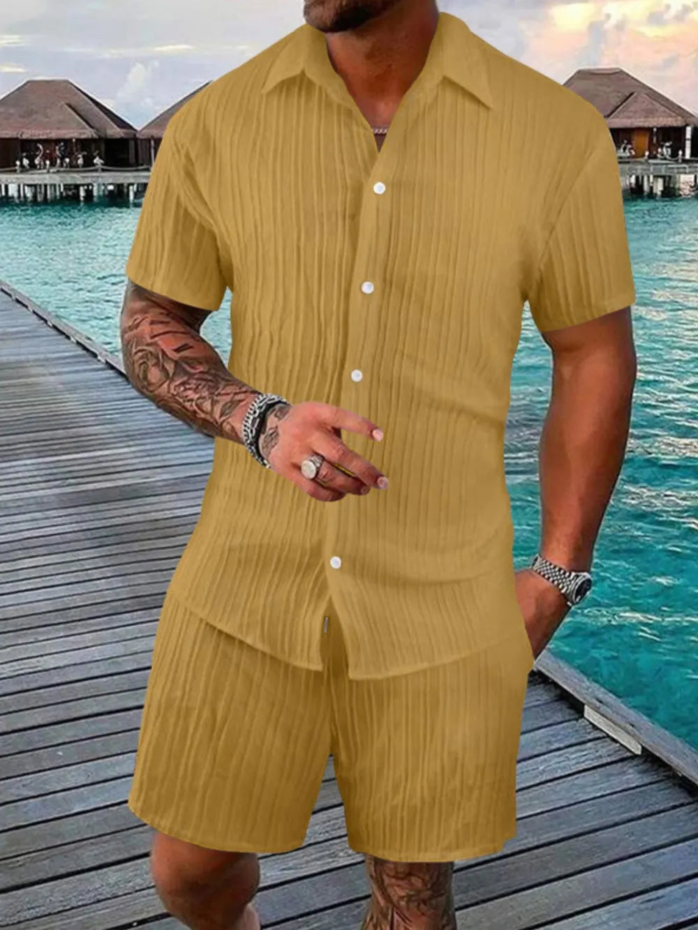 Textured resort shirt and shorts set in gold with vertical pleats and button front.