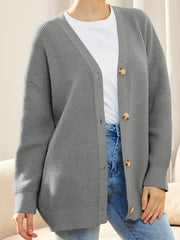 Gray ribbed knit cardigan with balloon sleeves and button front, styled with a white tee and jeans.