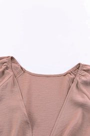 Tie-front blouson sleeve playsuit in Dusty Pink, showing neckline detail.