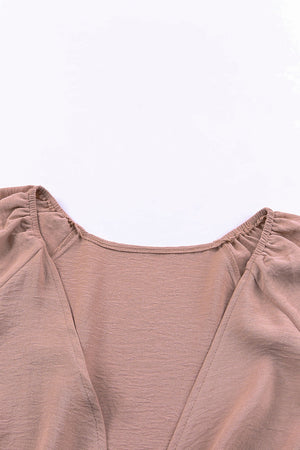 Tie-front blouson sleeve playsuit in Dusty Pink, showing neckline detail.