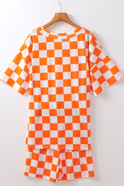 Checkered orange and white t-shirt and shorts set with crew neck and short sleeves.