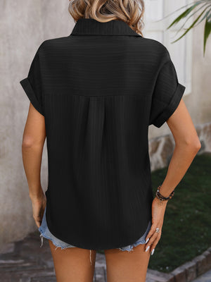 Black textured button-down shirt with cuffed short sleeves and a back yoke detail.