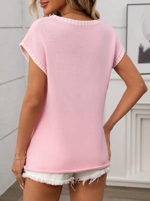 Blush pink knit V-neck top with white striped trim on sleeves and neckline.