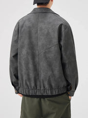 Dark gray vintage leather jacket with chevron detail and elastic hem.