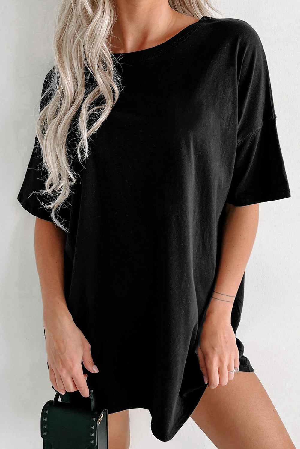 Black oversized slouch tee dress with crew neck and short sleeves.