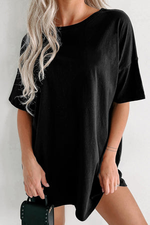 Black oversized slouch tee dress with crew neck and short sleeves.