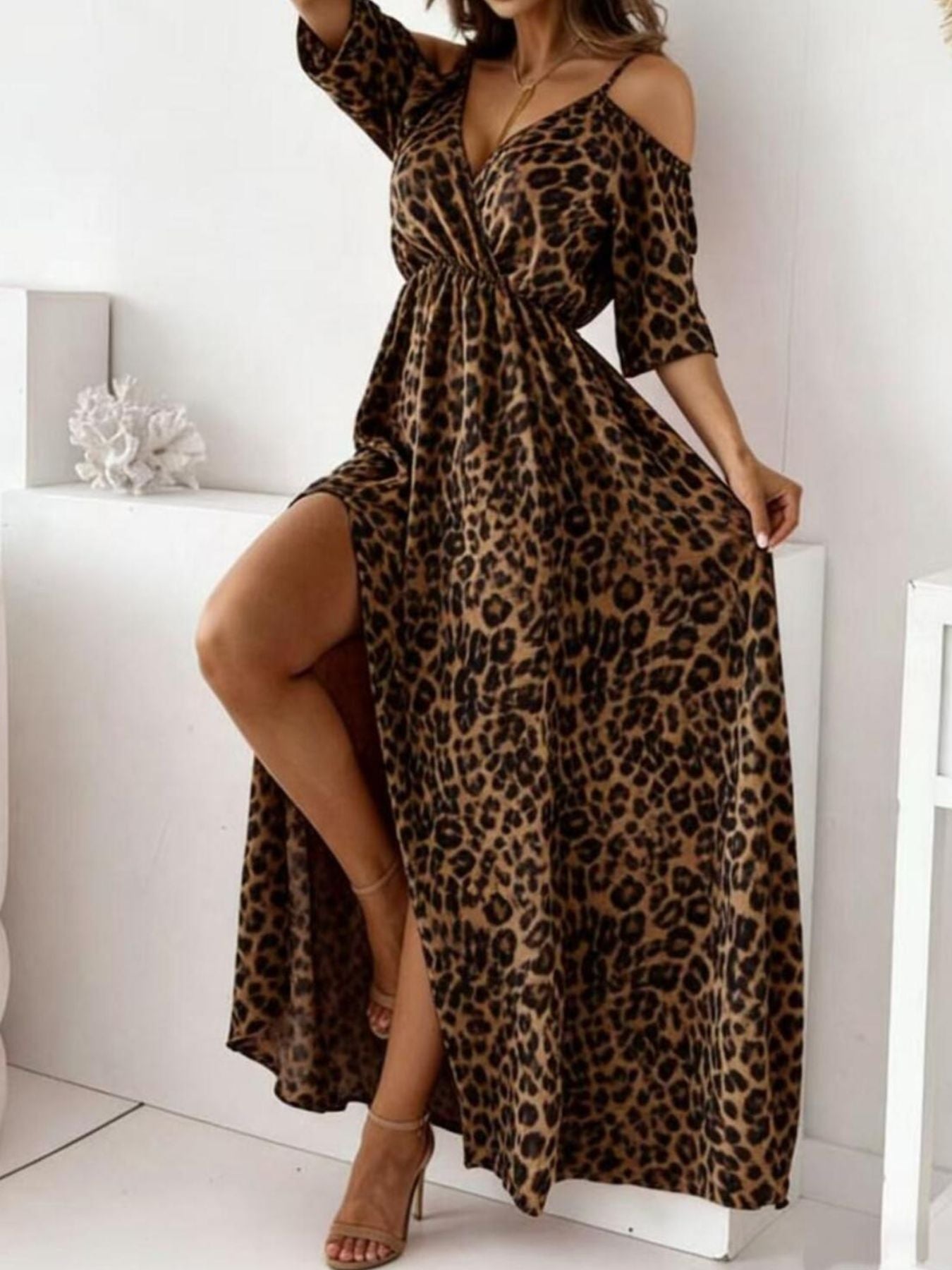 Brown leopard print cold shoulder maxi dress with high slit and V-neck.