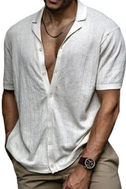 Textured knit resort collar shirt in ivory with button front and short sleeves.