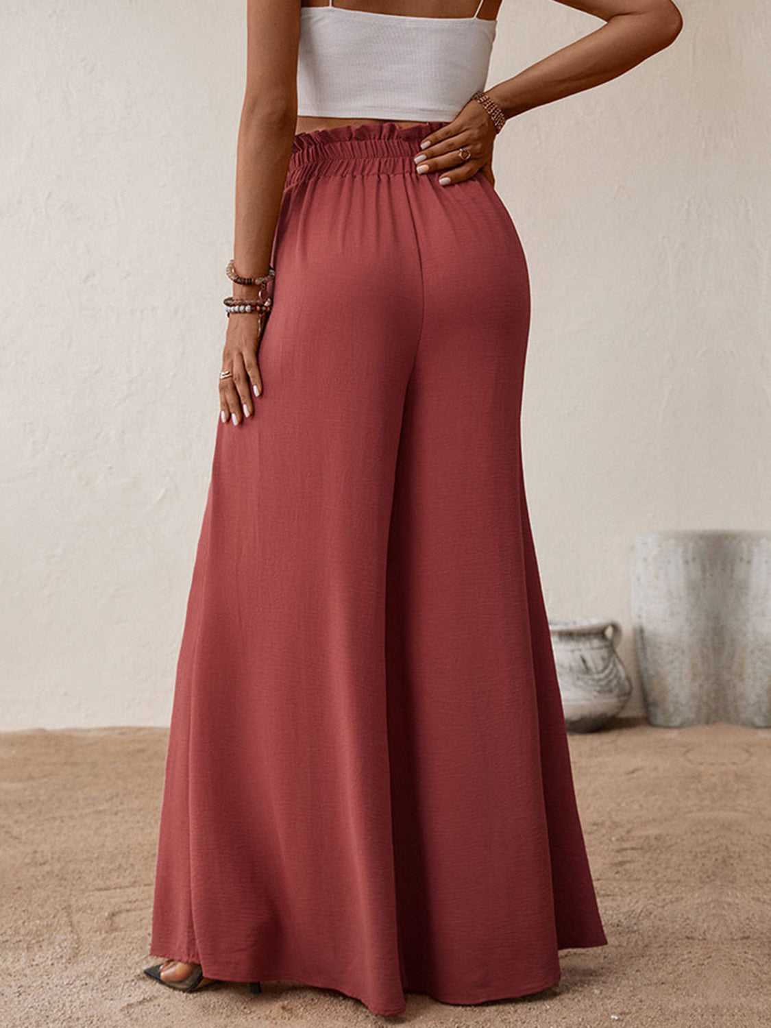 Ruffled waist palazzo trousers in rust, wide leg, casual flowy fit.