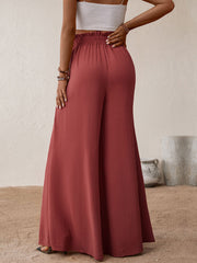 Ruffled waist palazzo trousers in rust, wide leg, casual flowy fit.