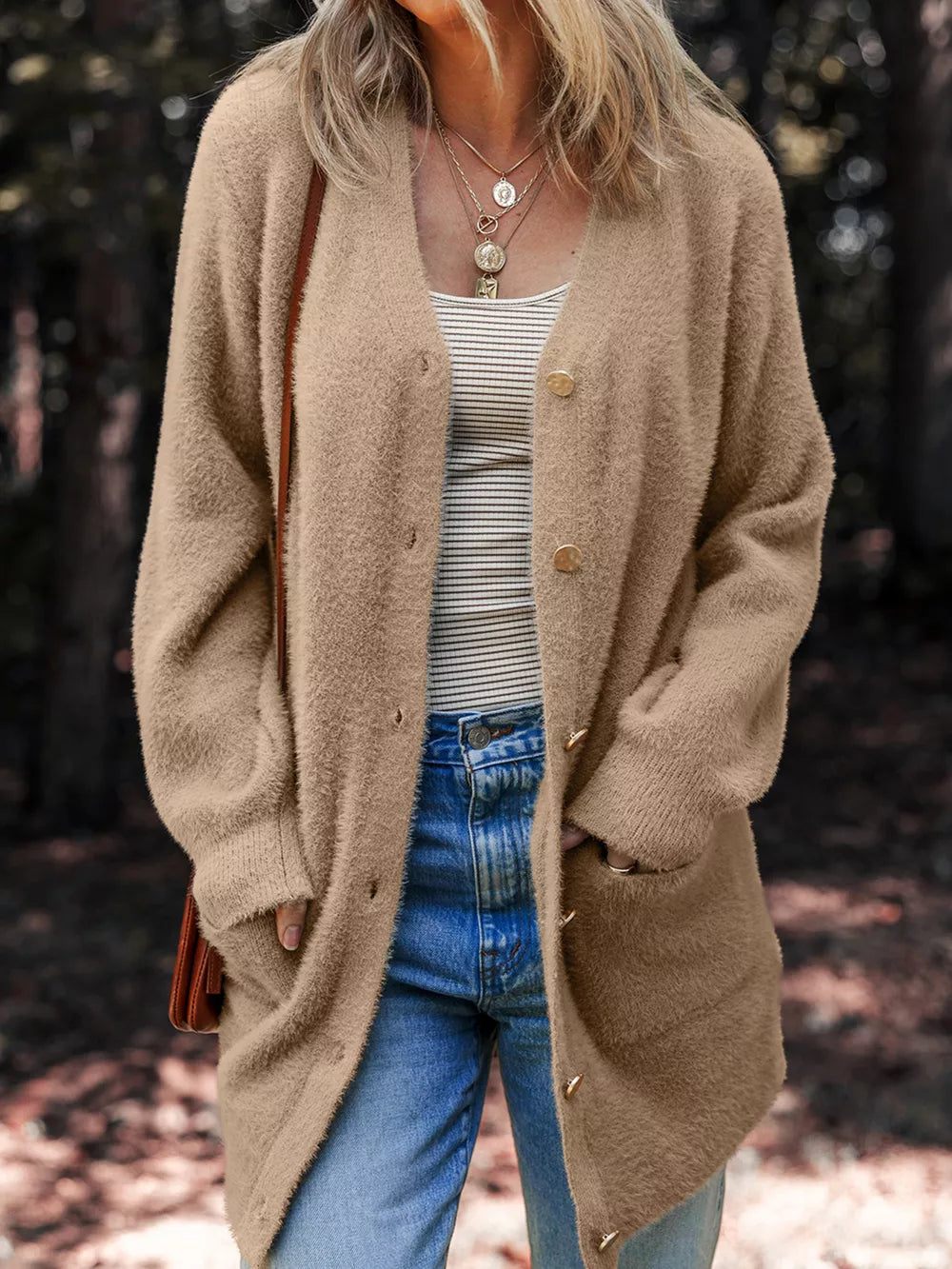 Camel fuzzy front-button cardigan with pockets and long sleeves.