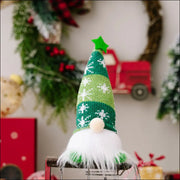 Illuminated Knit Gnome in green with snowflake pattern and white beard.