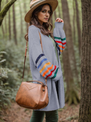 Heather gray knit duster cardigan with rainbow striped sleeves, open front, long sleeves.