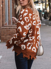 Brown leopard print knit sweater with raw edge hem and distressed details.
