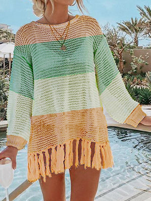 Open-knit beach cover-up with fringe detail in pastel stripes.