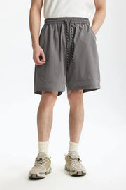 Men's gray drawstring chino shorts with a relaxed fit and subtle pocket detail.