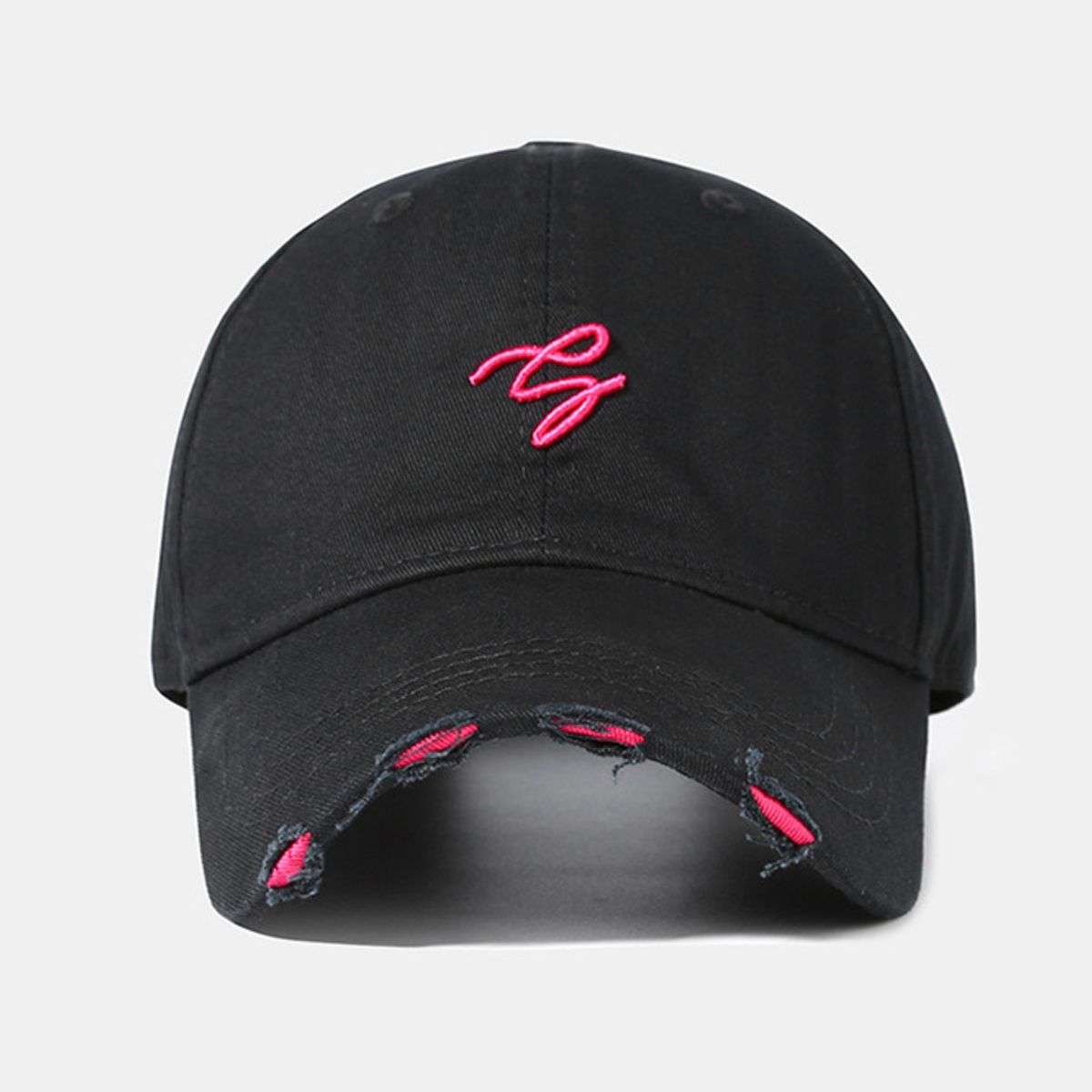 Black distressed cotton baseball cap with pink embroidery and frayed details.