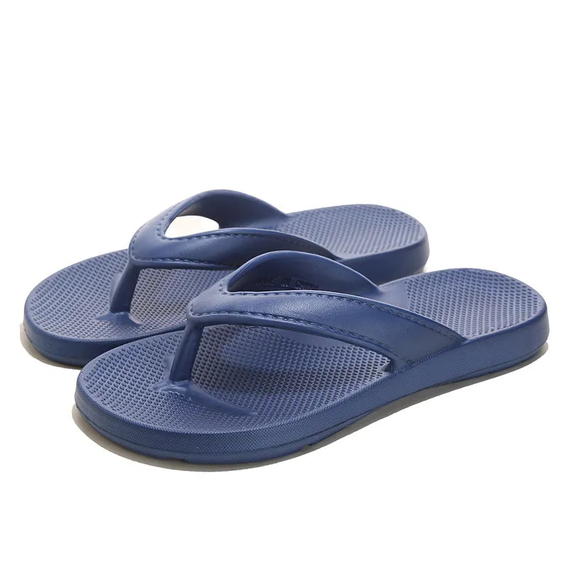 Navy textured rubber thong sandals with a waffle-patterned footbed.