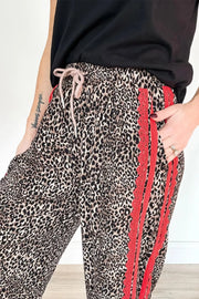 Maternity leopard print wide-leg pants with red lace trim and drawstring waist.