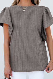 Gray cable knit sweater top with textured fabric and flutter sleeves.