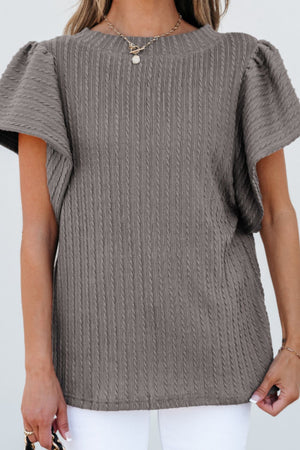 Gray cable knit sweater top with textured fabric and flutter sleeves.