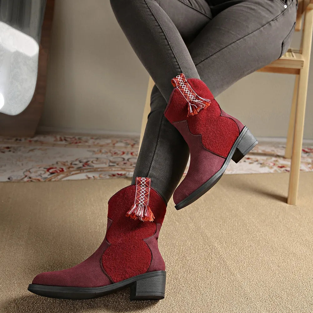 Burgundy suede and felt ankle boots with decorative tassels and stitching detail.