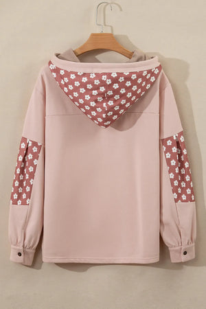 Dusty pink hoodie with floral patchwork on the hood and sleeves, button cuffs.